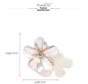 Close-up of a mini crystal flower hair clip with dimensions 2cm by 2cm in detail