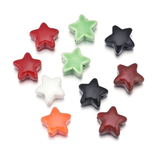 Macro shot of colorful ceramic star beads with thread holes for DIY jewelry making