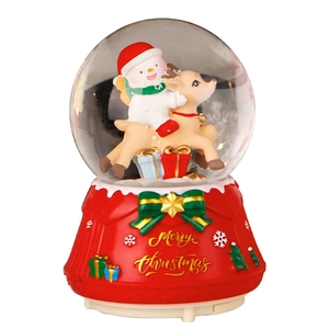 Christmas snowman and reindeer crystal ball music box on a festive red base
