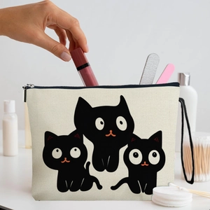 Canvas cartoon cat makeup bag with zipper being used for lipstick storage in daily life