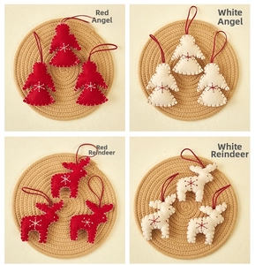 Close-up of felt Christmas ornaments featuring reindeer and angel with snowflake embroidery
