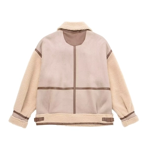 Back view of beige shearling jacket with dark brown leather piping and turn-down collar