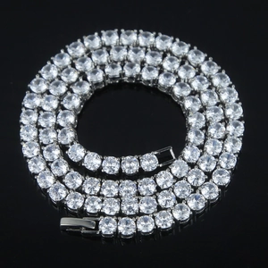 Sparkling 5mm silver tennis chain necklace with round cubic zirconia on black reflective background