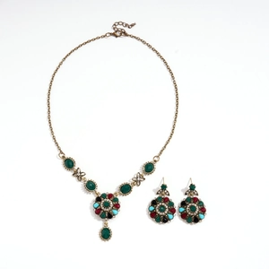 Vintage jewelry set with bronze necklace and earrings featuring multicolor rhinestones