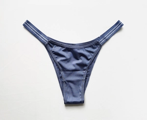 Detail of dark blue ice silk low-rise seamless panties with silver striped waist straps