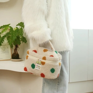 Chic plush beige makeup bag with colorful 3D polka dots and floral zipper charm