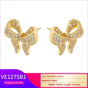Detailed view of gold-plated brass bow earrings with pavé zircons and 16x19.5mm dimensions