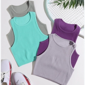 Slim fit nylon yoga tanks in four colors with ribbed texture and athletic props