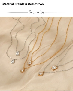Macro detail of gold and silver zircon pendant necklaces on luxury champagne silk fabric