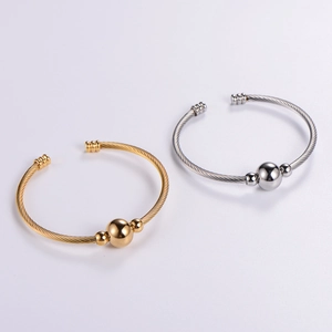 Classic stainless steel cable twist bangle with polished beads in gold and silver