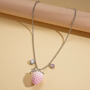 Detail of strawberry heart charms with pink zircon on silver bead necklace chain