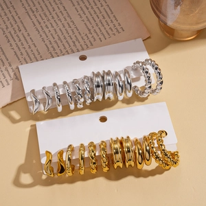 Set of 12 geometric hoop and stud earrings in gold and silver finish with textured designs