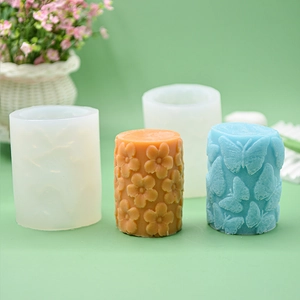 Cylindrical silicone candle molds with 3D butterfly and floral relief patterns