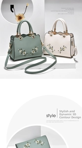 Close-up of floral embroidery on soft PU leather handbags with wavy edges and heart charm