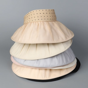 Detailed top view of various organza sun hats with polka dot bow and wide brims