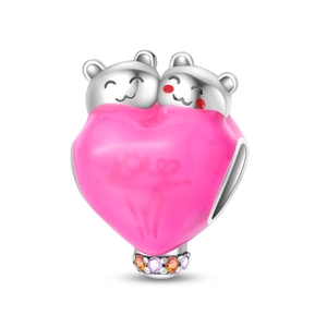Detailed view of pink heart charm with cartoon ears, Love engraving and colorful crystals