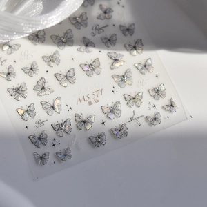 Detailed macro view of holographic MS571 butterfly nail stickers with rhinestones