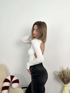 Detail shot of the back hollow-out design on a white long-sleeve ribbed bodysuit