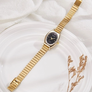 Elegant gold oval women's watch with black dial and vintage metal mesh band