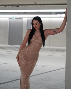 Detail of nude mesh maxi dress featuring shimmering silver sequins and crystal embellishments