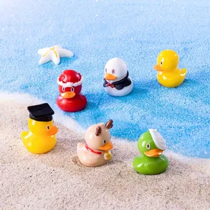 Miniature resin duck figurines set featuring Christmas and graduate themes for desk decor