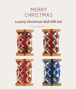 Macro view of assorted Christmas ball ornaments in a clear luxury portable gift box