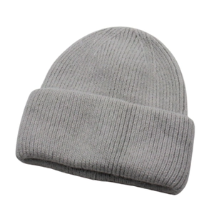 Close-up of light grey winter beanie showing vertical rib-knit texture and soft wool material