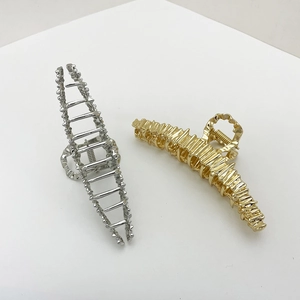 Irregular large metallic hollow wave hair claw clips in elegant gold and silver finishes