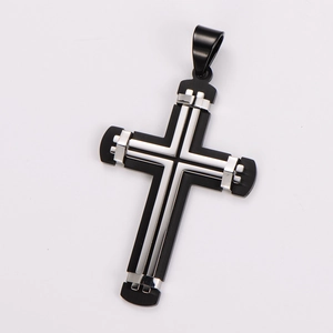Close-up of minimalist two-tone cross pendant in silver and matte black stainless steel