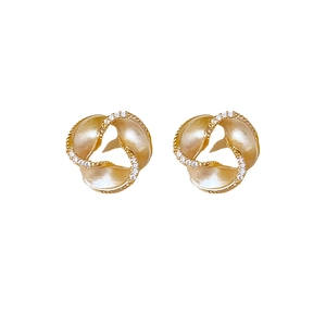 Elegant gold spiral petal earrings with pearl finish and crystal accents on white background