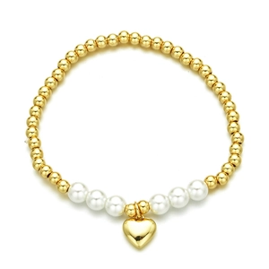 Beaded gold bracelet featuring white faux pearls and a golden heart-shaped pendant charm