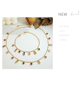 Detail view of colorful zircon stone necklace and bracelet set in gold titanium steel