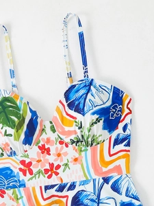 Detail of tropical floral print tankini top with adjustable straps and pleated cups