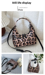 Close-up of leopard print patent leather hobo bag with top handle and zip closure