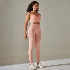 Close-up of pink seamless yoga set showing breathable knit texture and cross back detail