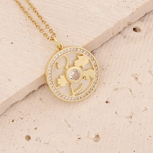 Gold-plated 18K necklace with circular mother of pearl pendant and clover flower design