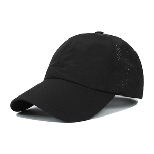 Detail view of black breathable quick-dry baseball cap with side laser-cut vents