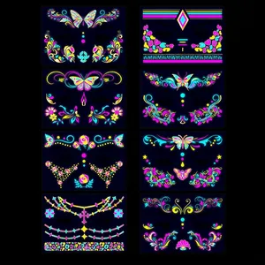 Neon UV fluorescent face tattoos in butterfly and floral designs for music festivals