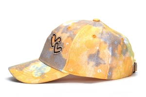 Vibrant tie-dye baseball cap for kids with sparkling rhinestone double hearts on side