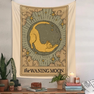 Bohemian tarot style wall tapestry featuring a black cat and waning moon on beige linen
