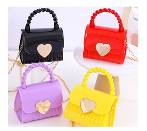 Mini jelly handbags in four colors featuring metal heart locks and chain straps