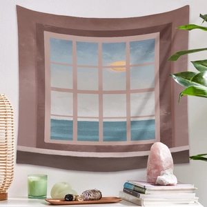 Détail d'une tapisserie bohème avec vue sur mer au coucher du soleil à travers une fenêtre