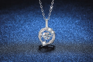 Macro shot of s925 silver feather necklace featuring a dancing moissanite stone