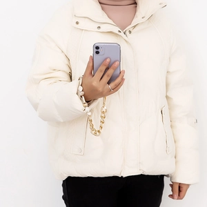 Bohemian pearl and gold chain phone strap accessory held by a model for smartphone