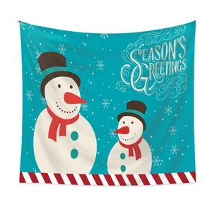 Detail of Christmas snowman tapestry featuring Season's Greetings text and snowflake patterns