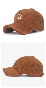 Close-up of brown teddy fleece baseball cap with white embroidered R letter detail