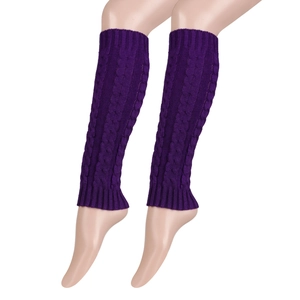 Detailed close-up of dark purple knit leg warmers with classic chunky cable pattern