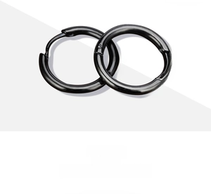 Close-up of minimalist black stainless steel hoop earrings with a smooth polished finish