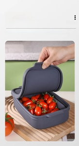 Detailed view of grey silicone rectangular container for fruit storage and food preservation