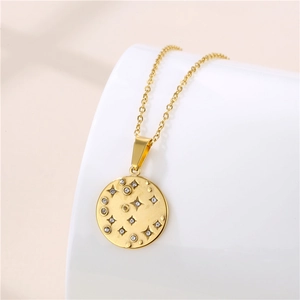 Gold plated North Star pendant necklace with sparkling cubic zirconia on a white display